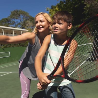 caucasian-mother-and-son-outdoors-playing-tennis-2022-02-07-22-22-35-utc.jpg