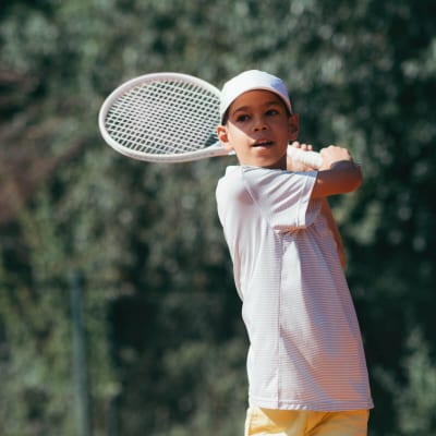 tennis-instructor-with-boy-in-tennis-lesson-2021-08-26-16-54-04-utc.jpg