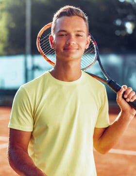 young-man-teenager-with-tennis-racket-standing-nea-2021-09-03-05-42-00-utc.jpg